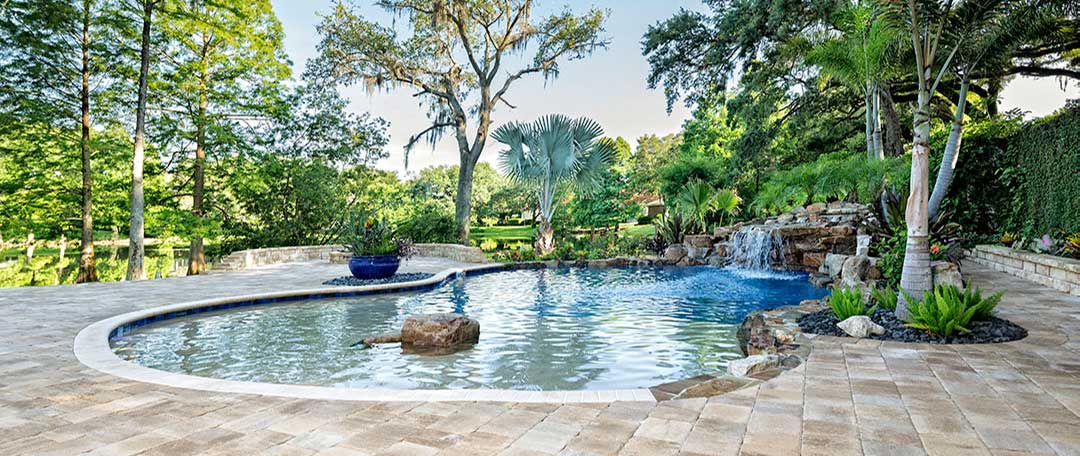 pool-with-stone-pavers-and-waterfall.jpg